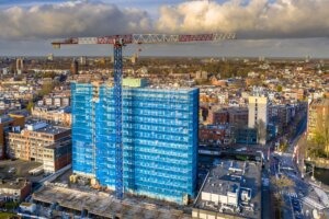 Construction crane building high rise apartment