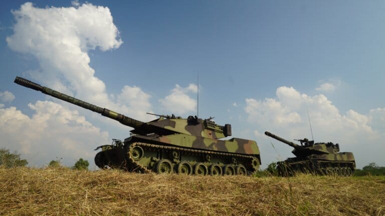 military soldier with rifle in armored tank.