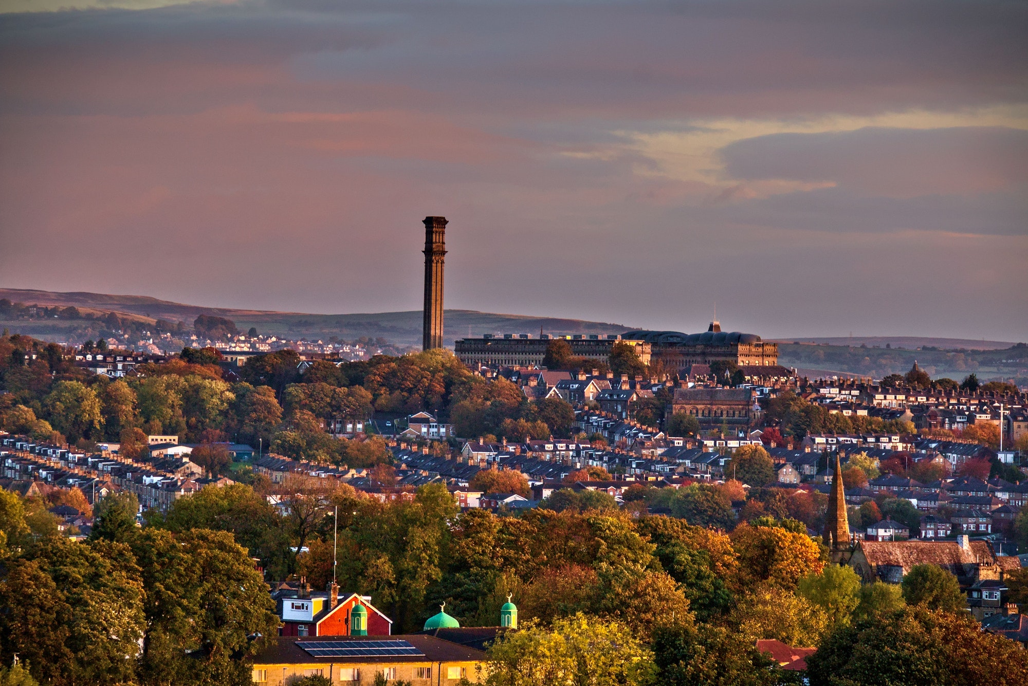 Aerial shot of an old mill in the city of Bradford under the gloomy clouds in Yorkshire, England