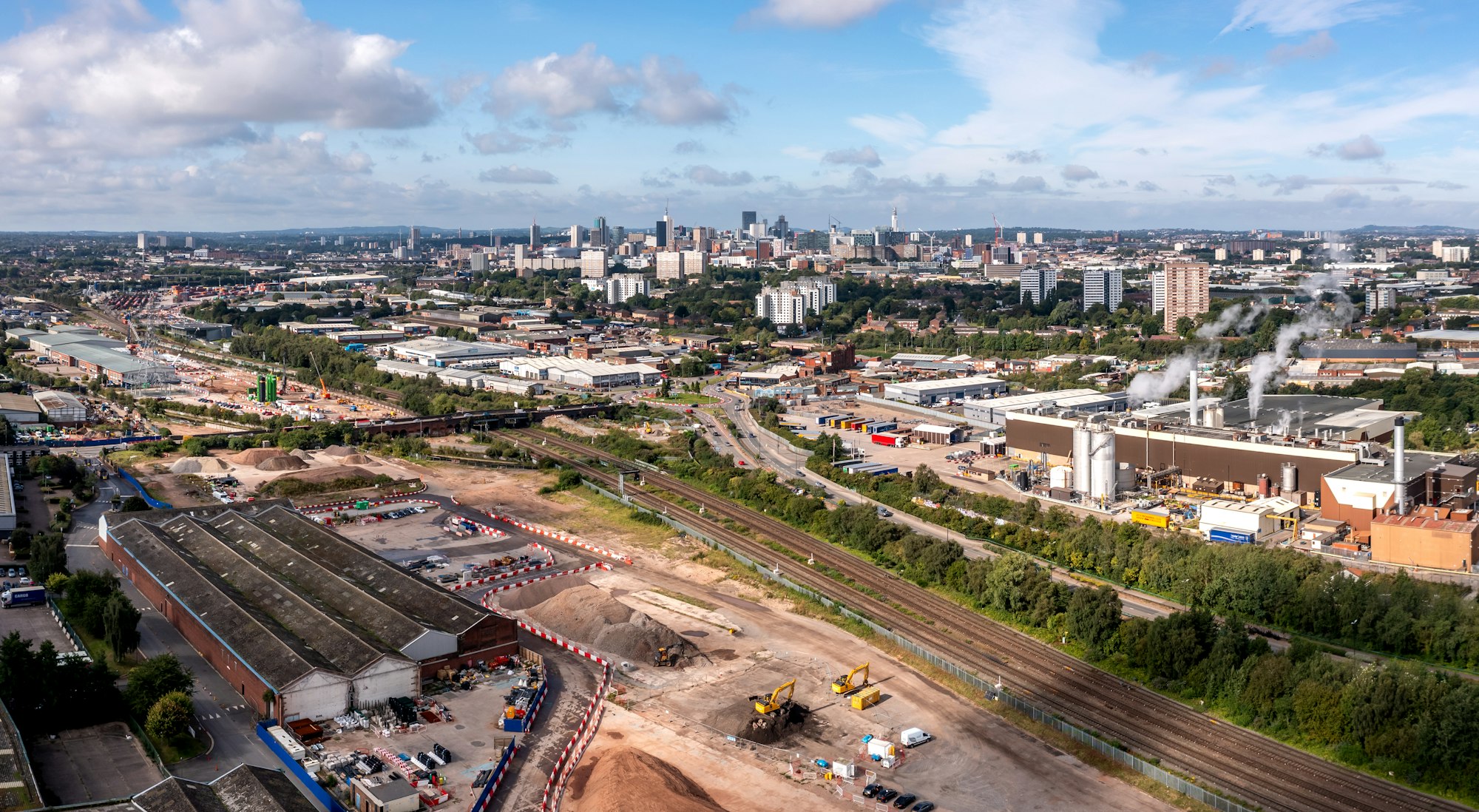 Aerial view of a Birmingham cityscape skyline with HS2 construction site