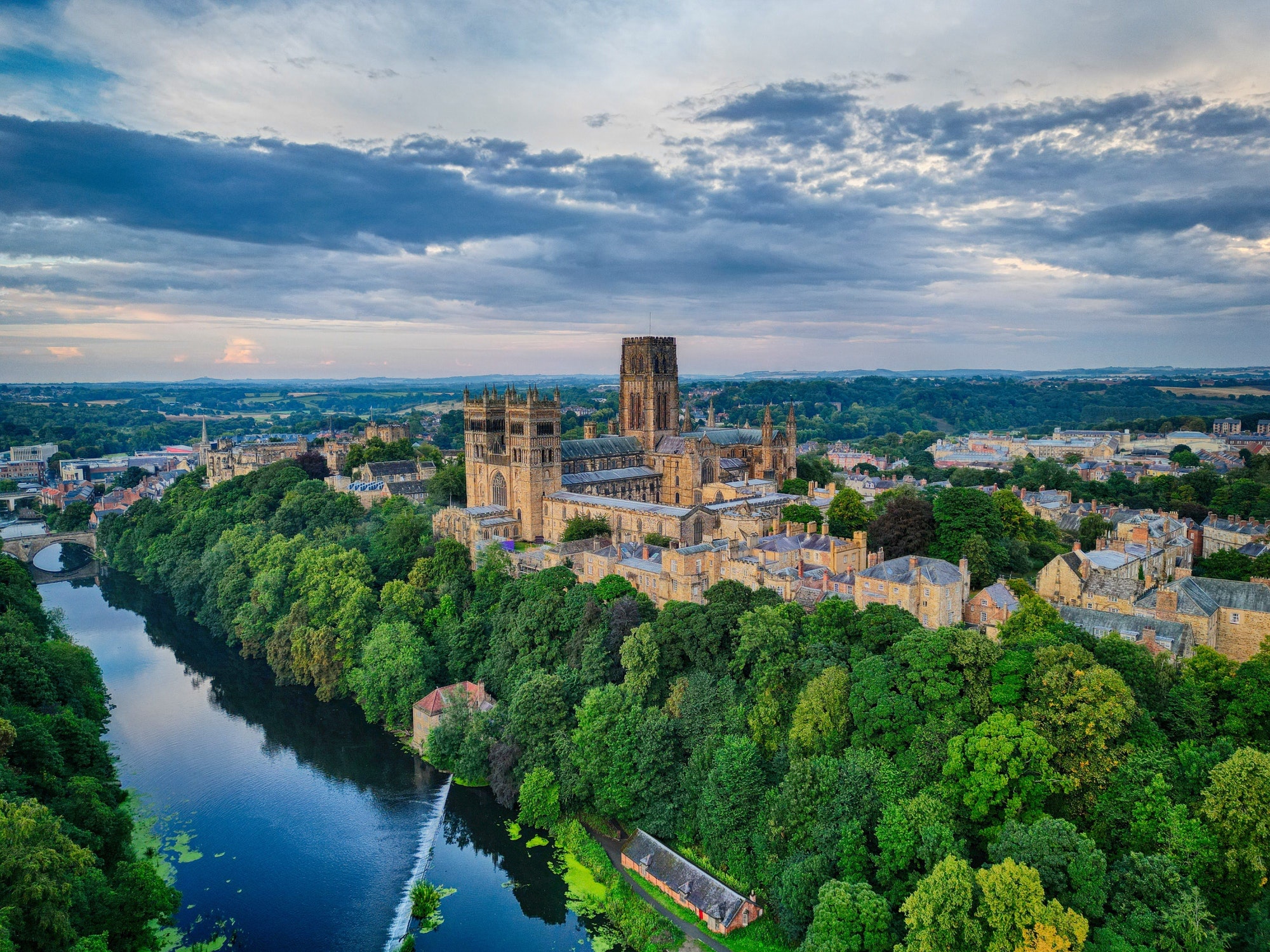 Aerial view of the Durham Cathedral, castle and river on a sunset