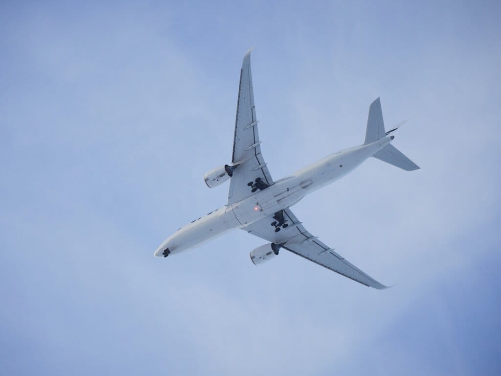 Plane in blue sky.