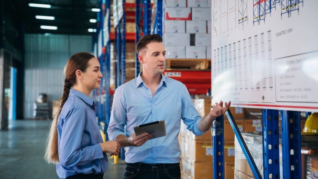 Warehouse worker stack hand and shake hands to show success in the warehouse.