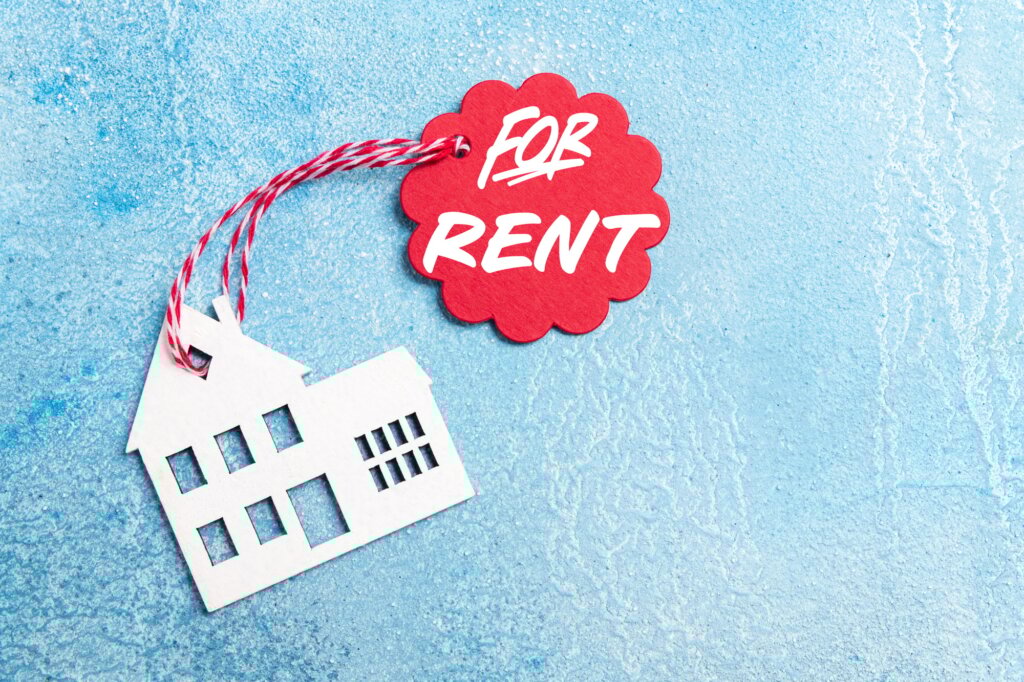 House for rent label on christmas holidays. Wooden house symbol with rent tag on blue background